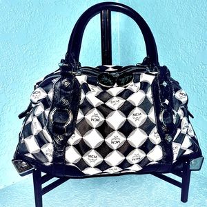 MCM 100% Auth.limited edition canvas leather bag .Princess lion logo zip closure